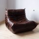 Togo armchair in dark brown shiny leather