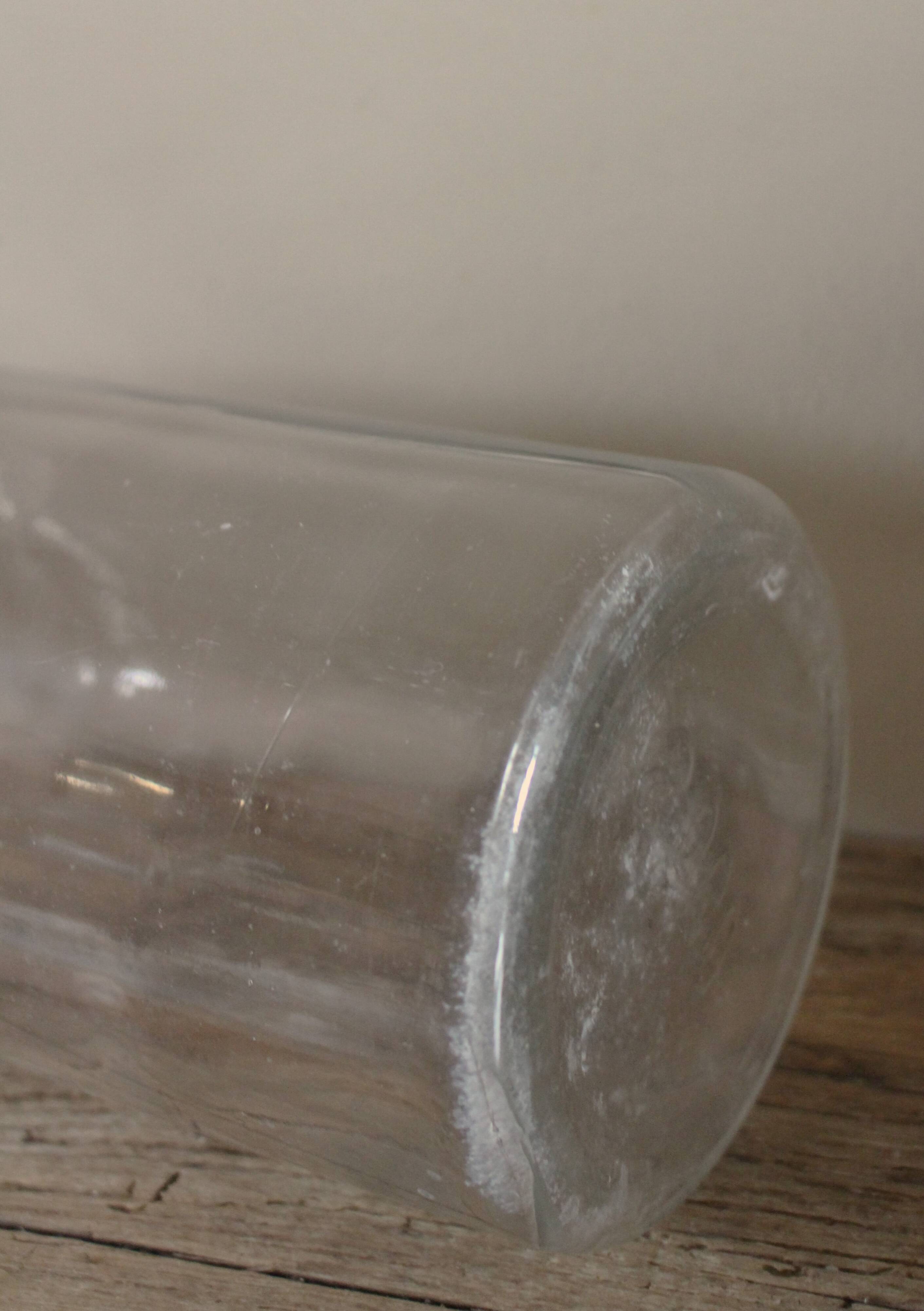 Large antique transparent glass bottle vase