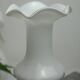 Corolla vase in white opaline with orange-brown patterns.