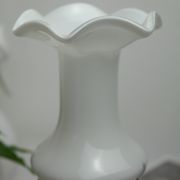 Corolla vase in white opaline with orange-brown patterns.