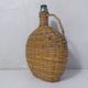 old bottle dressed in rattan vintage pilgrim gourd