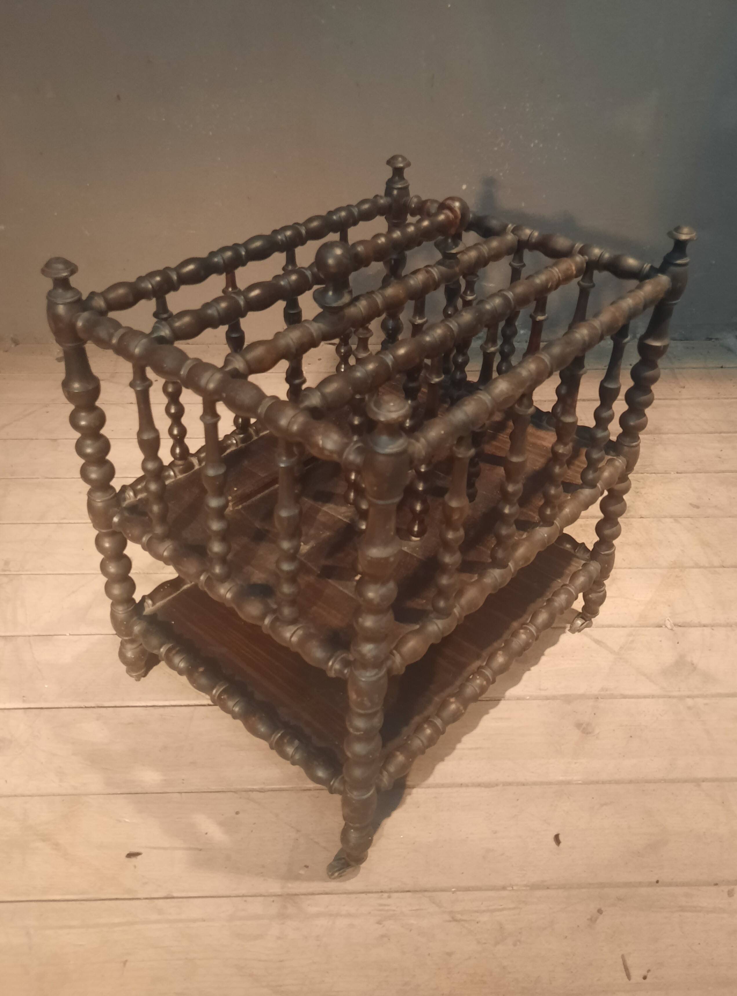 Rosewood magazine rack on casters