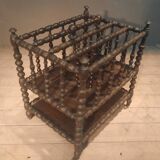 Rosewood magazine rack on casters