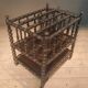 Rosewood magazine rack on casters