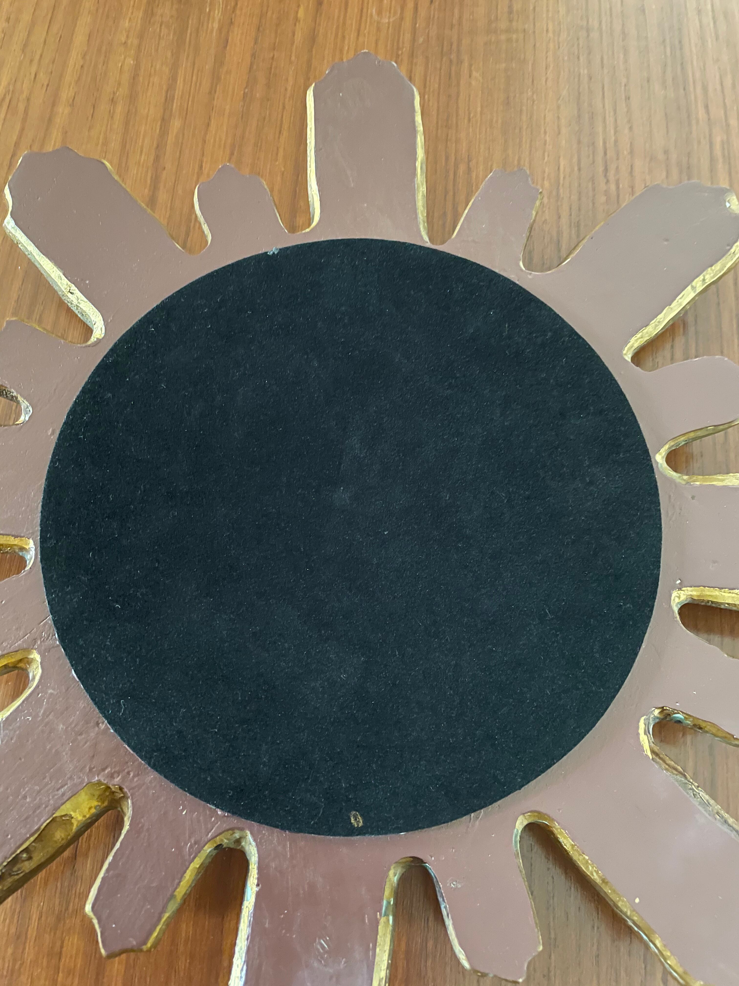 Vintage sun mirror in 60s/70s gold resin