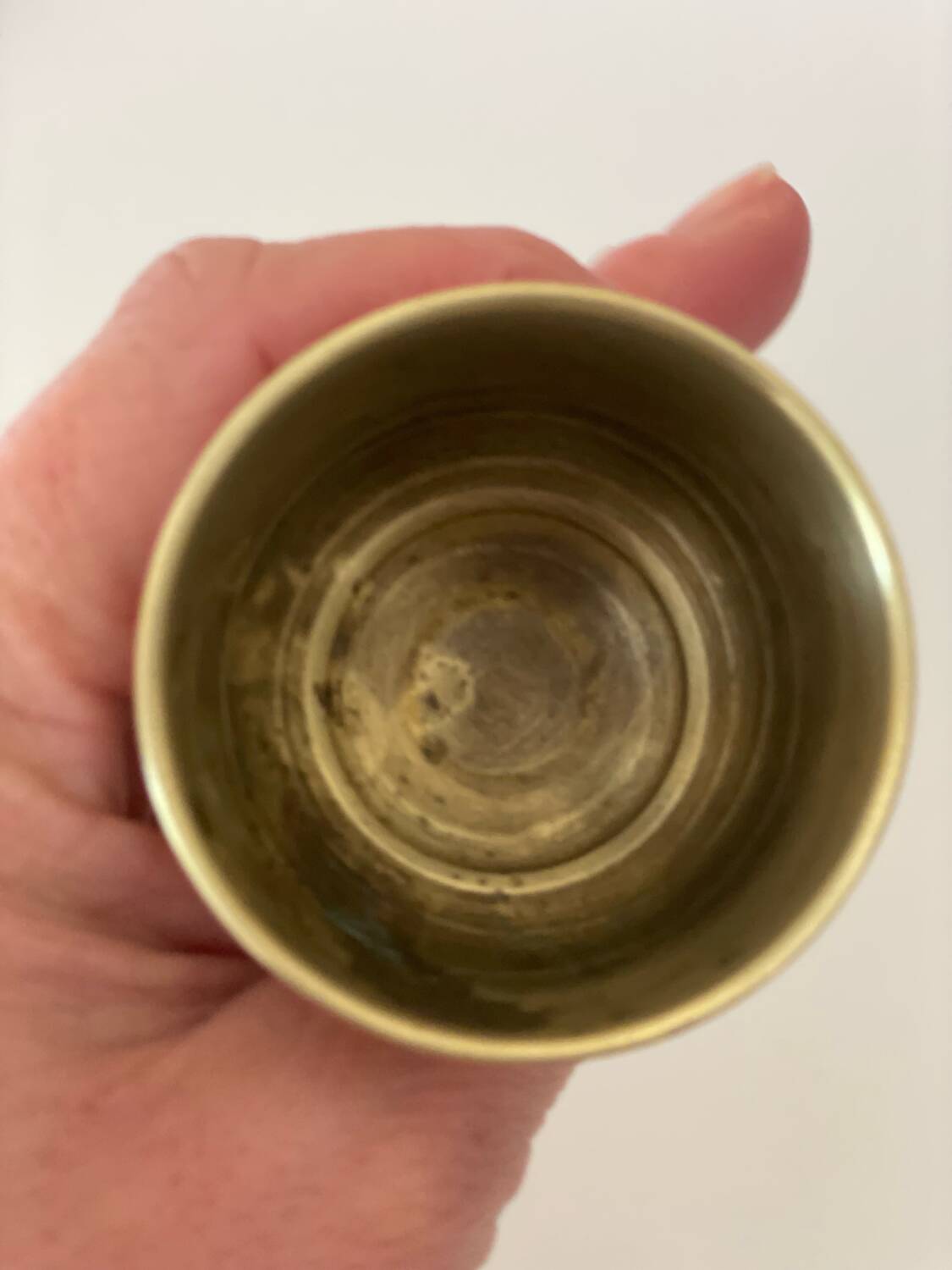 4 golden brass egg cups