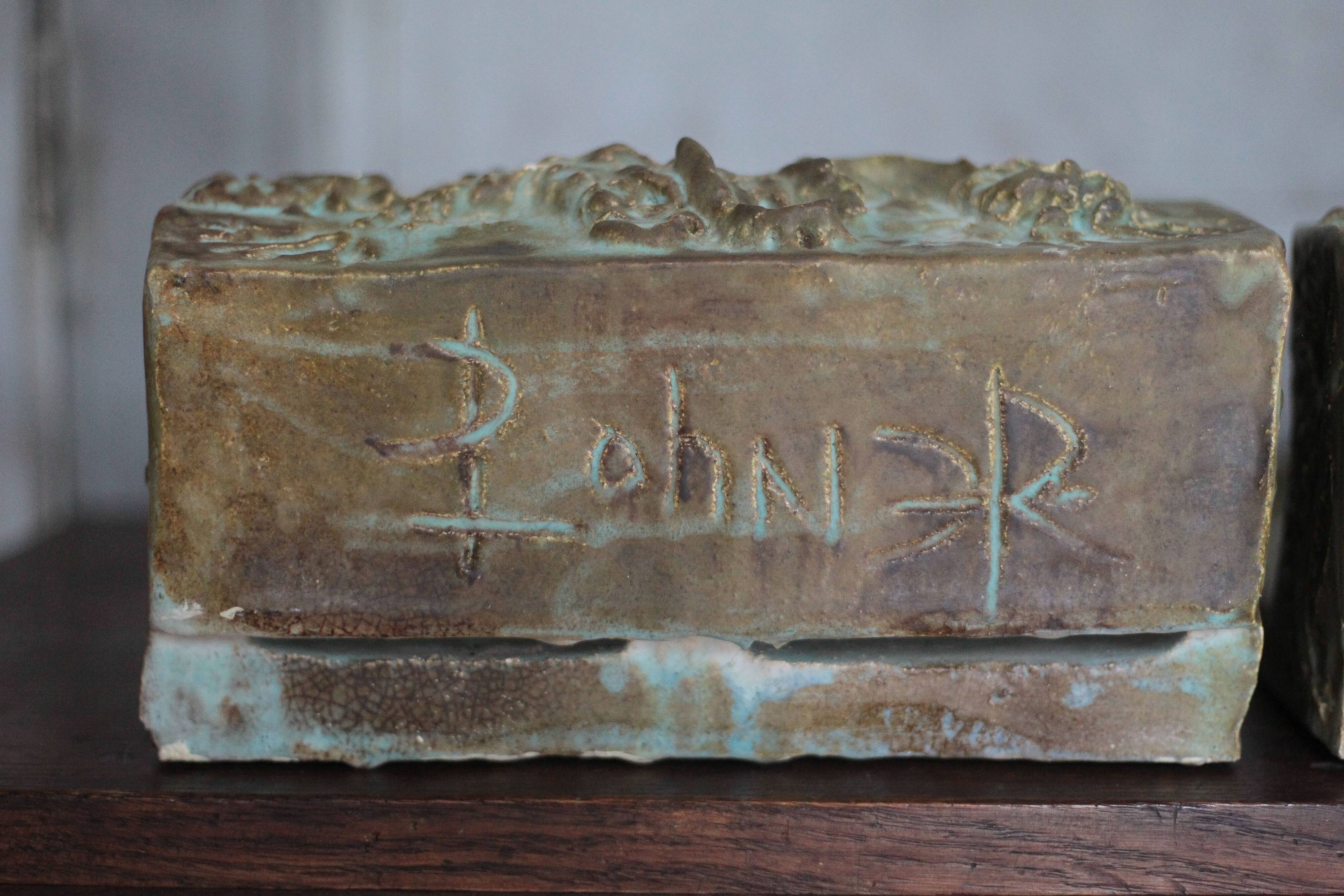 Pair of signed ceramic wall planters, pot cover