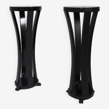 Pair of high round black lacquered wooden pedestal tables, 1960s.