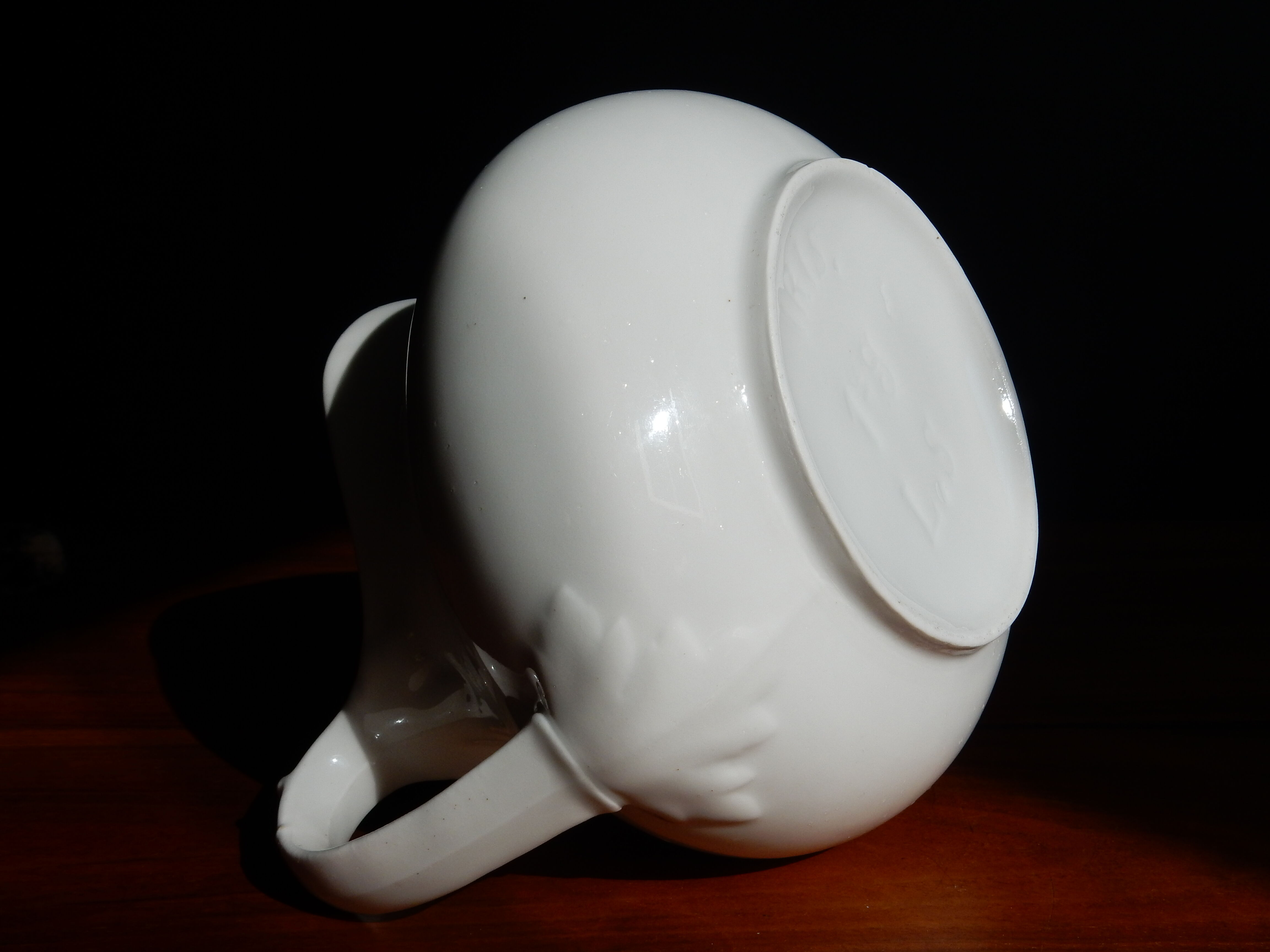 White ceramic water pitcher broc pot