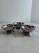 Set of 3 stainless steel dessert bowls on stands.