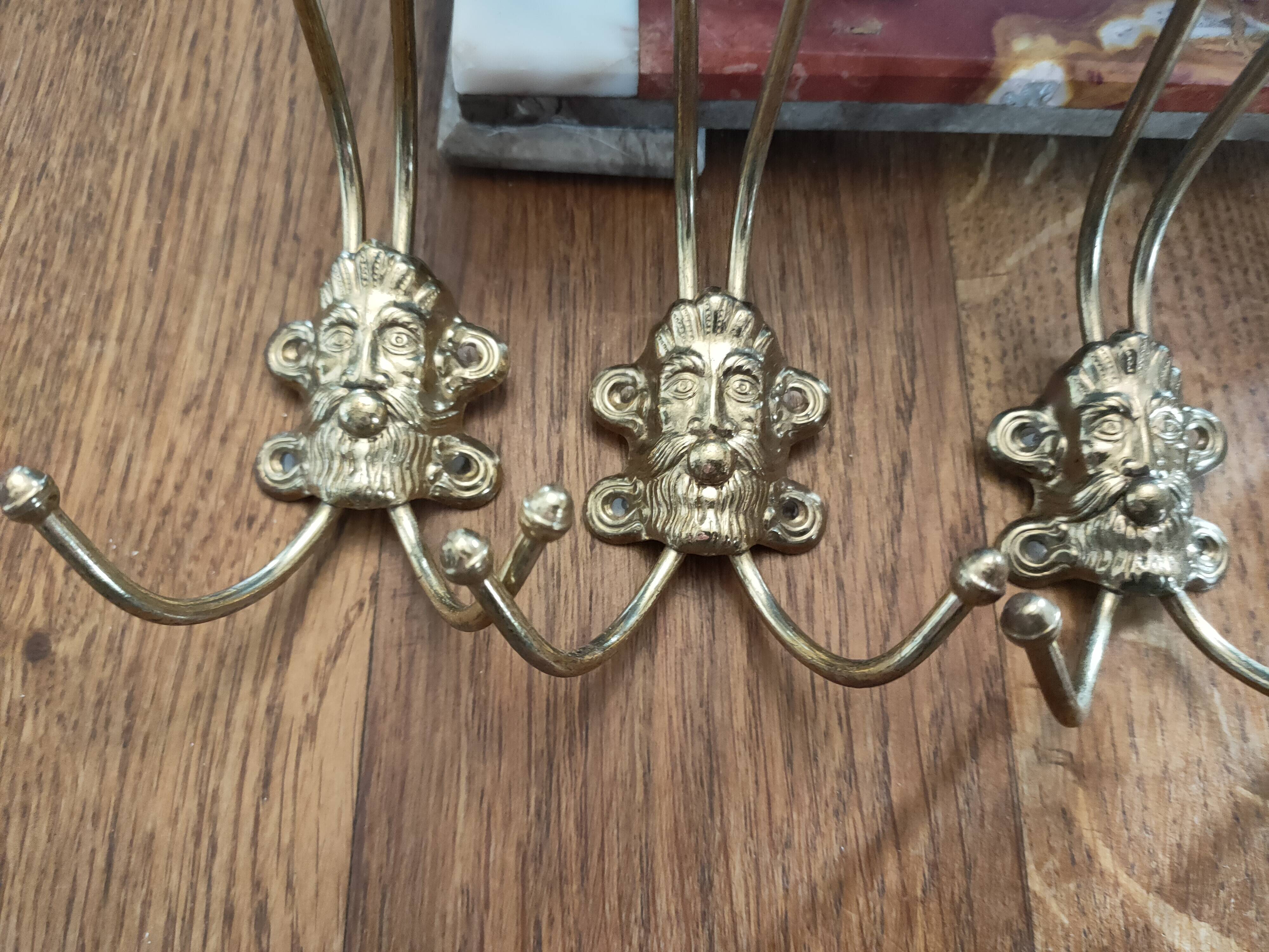 set of 5 antique gold metal hooks