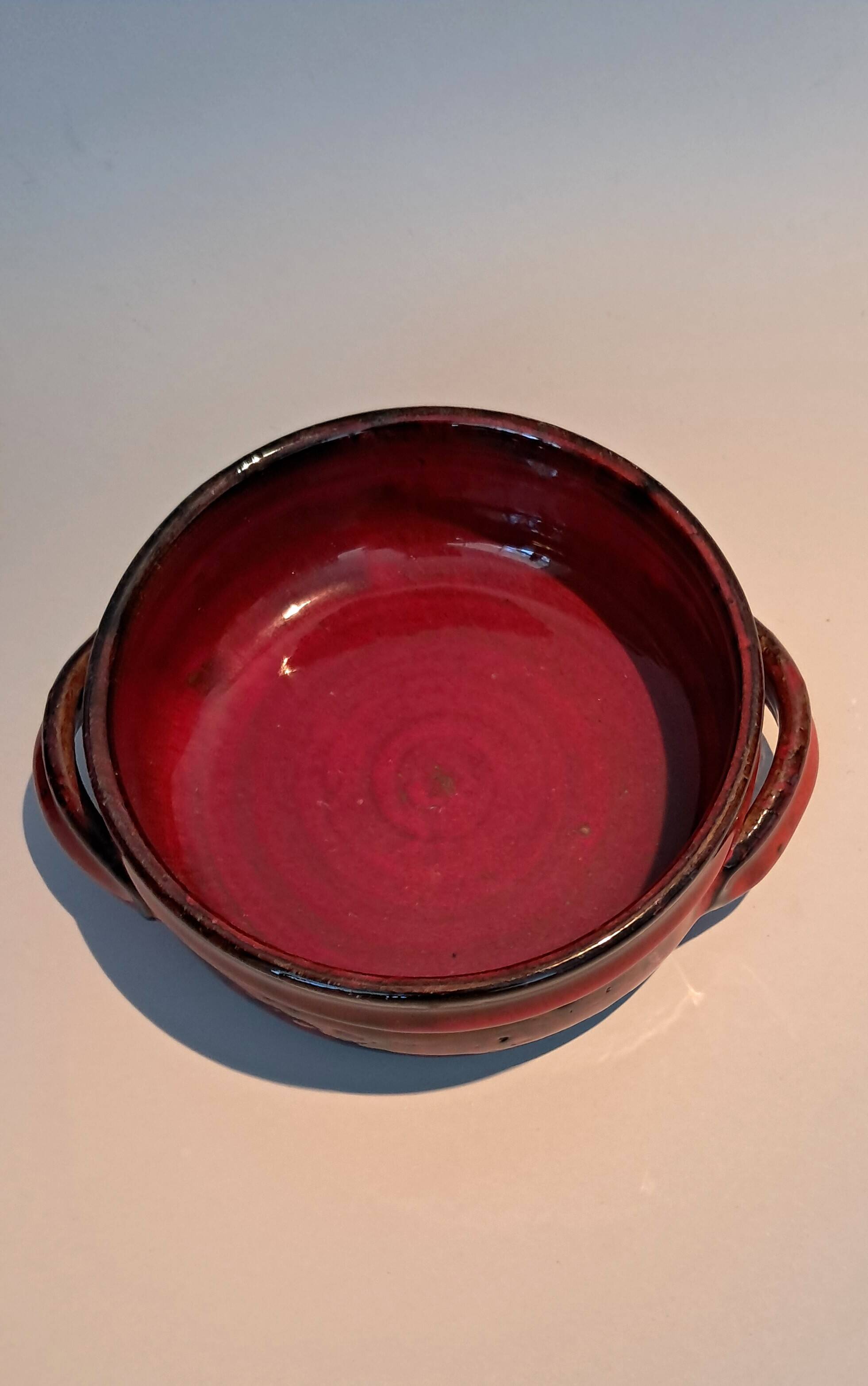 Red ceramic pieces by Gérard Hoffman (1917/1965).