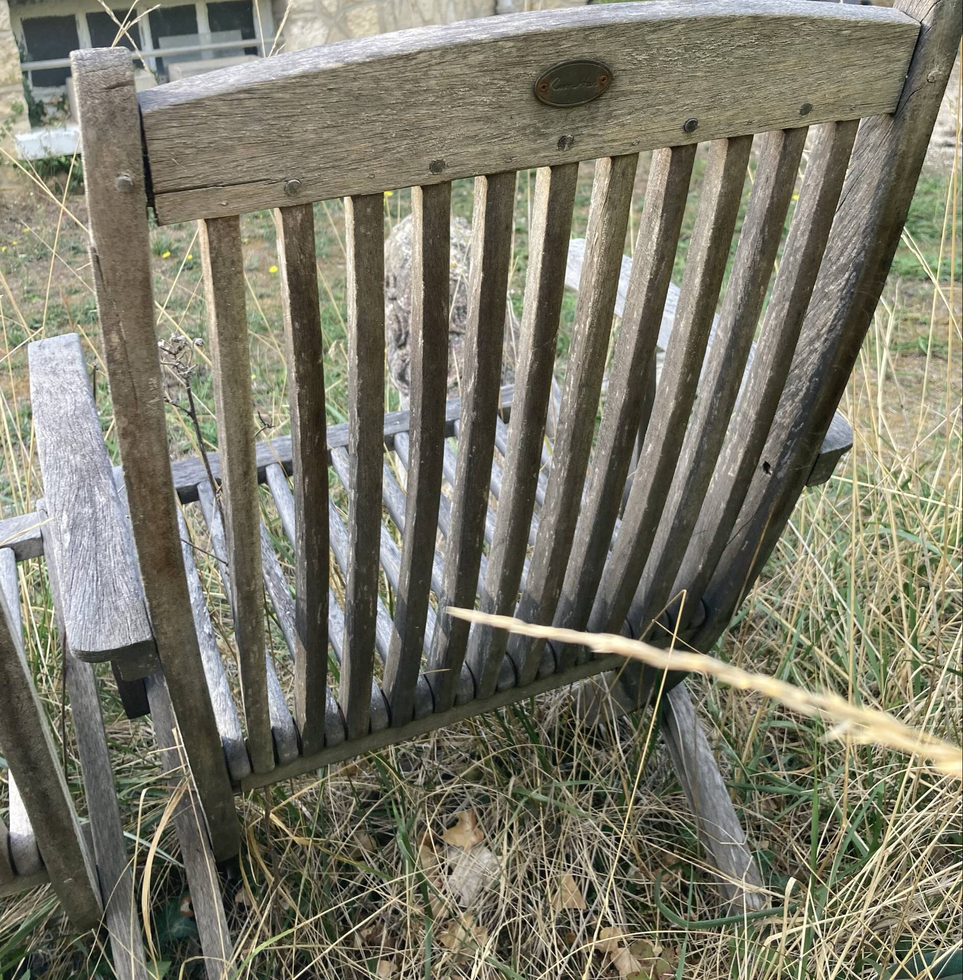 Folding garden chairs and armchairs in River Han dowelled teak.