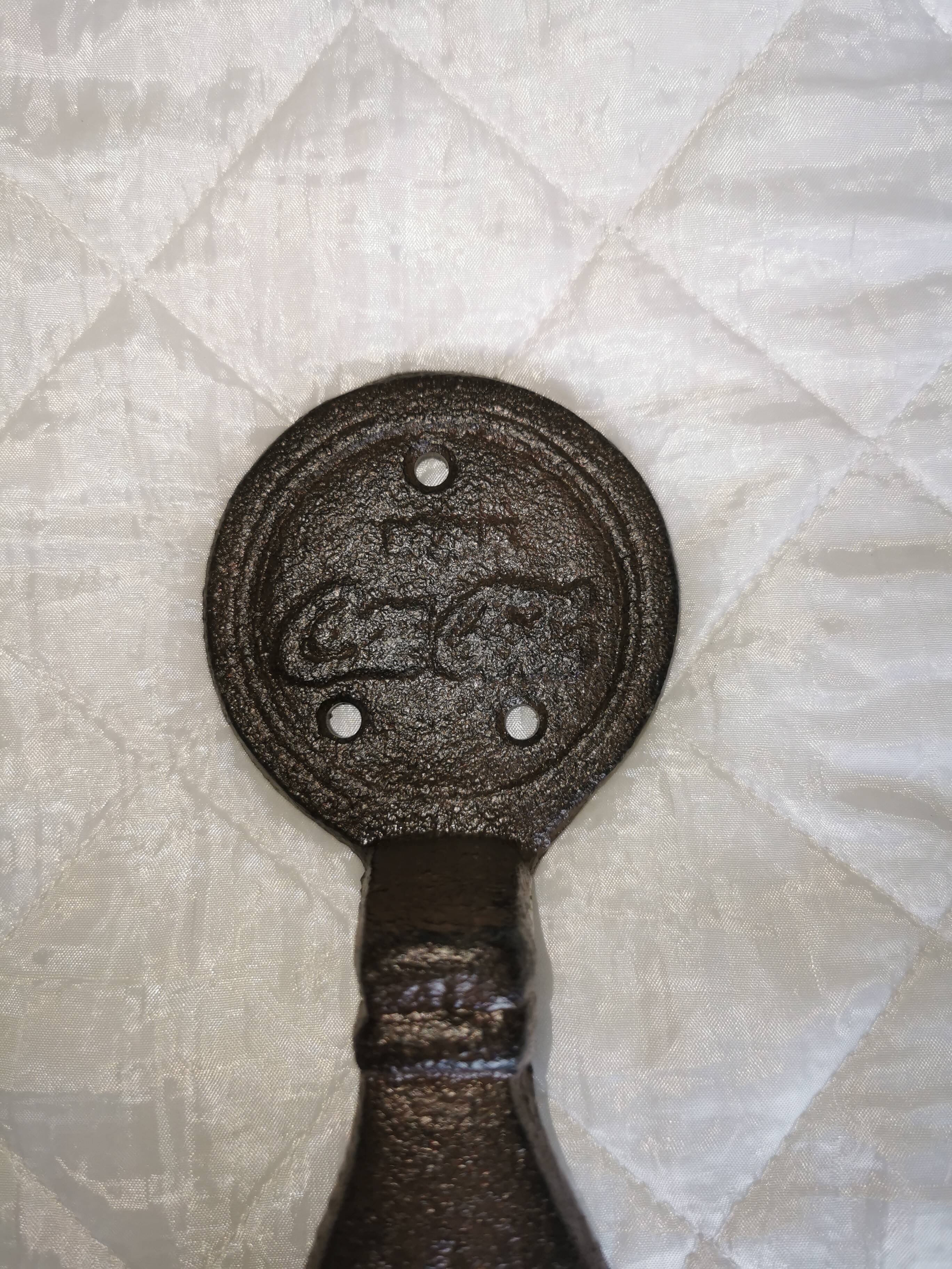 Cast-and-white coca cola door handles