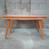 Dining table with compass feet