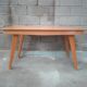 Dining table with compass feet