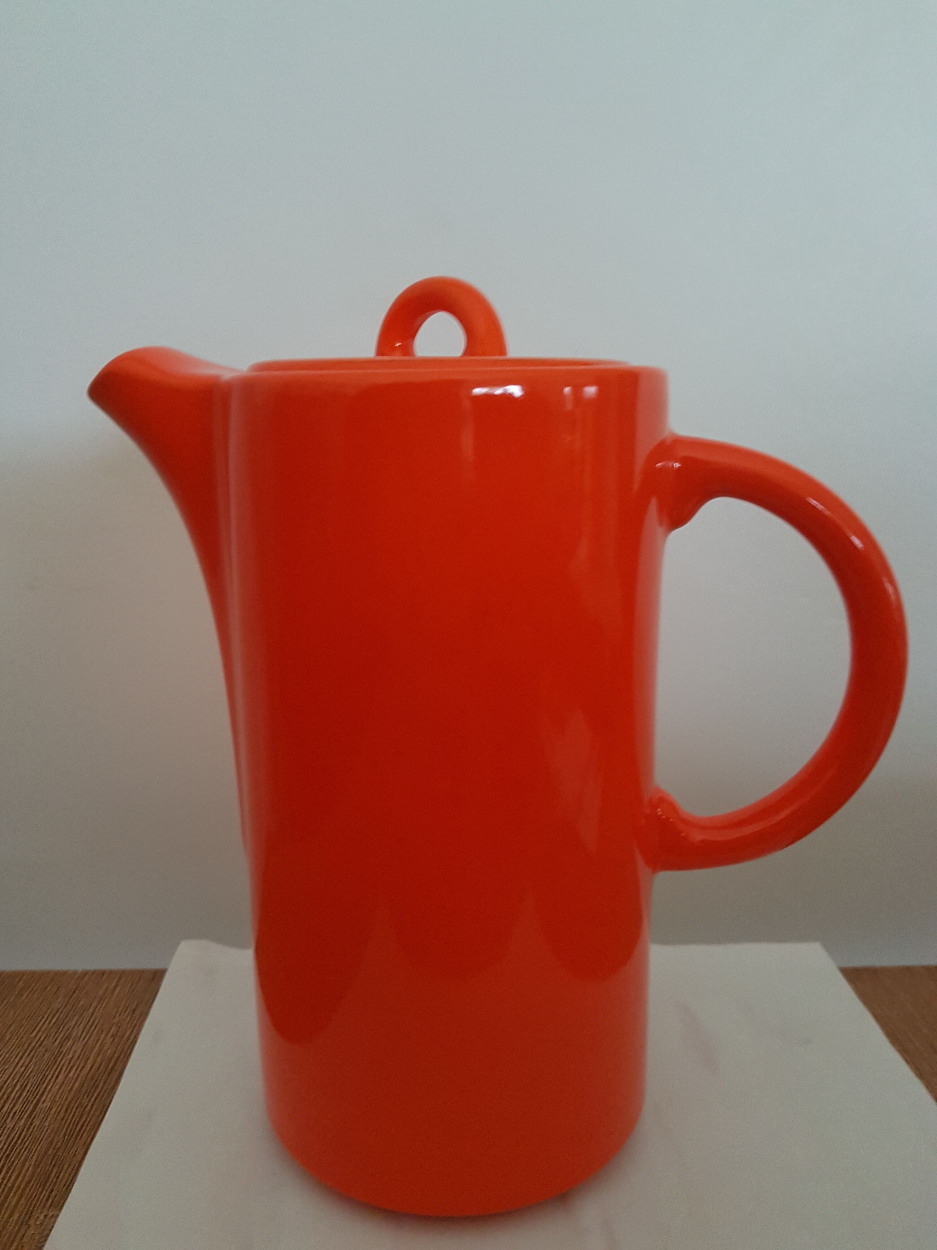 Coffee pot has orange 1970 sugar milk