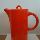 Coffee pot has orange 1970 sugar milk