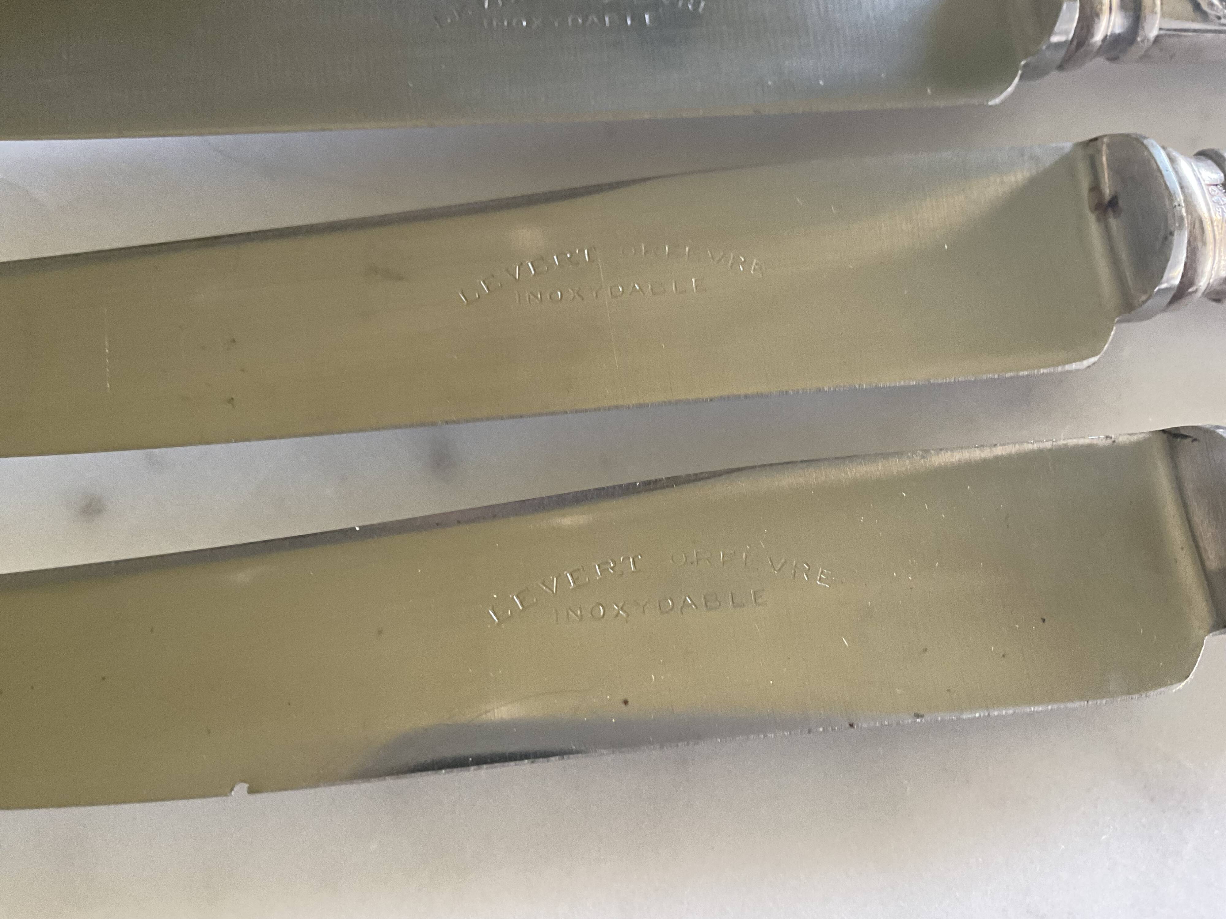 12 silver-plated metal knives. levert silversmith