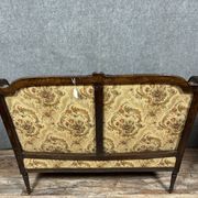 Banquette à oreilles de style Louis XVI en bois sculpté vers 1850