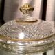 Butter dish or candy dish in pressed glass molded with golden rim