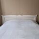 Large antique white wooden headboard, 190 cm wide.