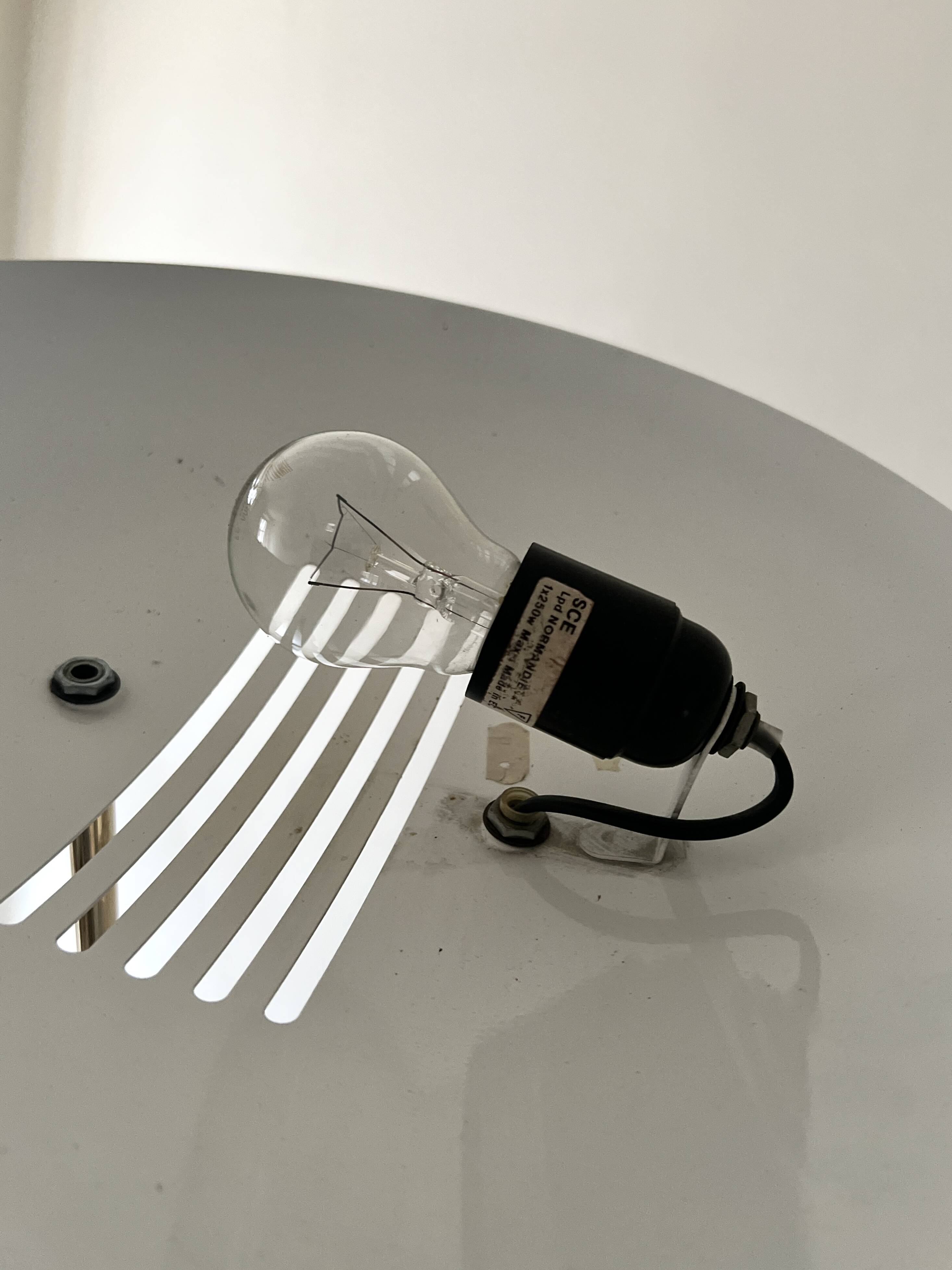 Modernist halogen floor lamp with a gold bowl, 1980.