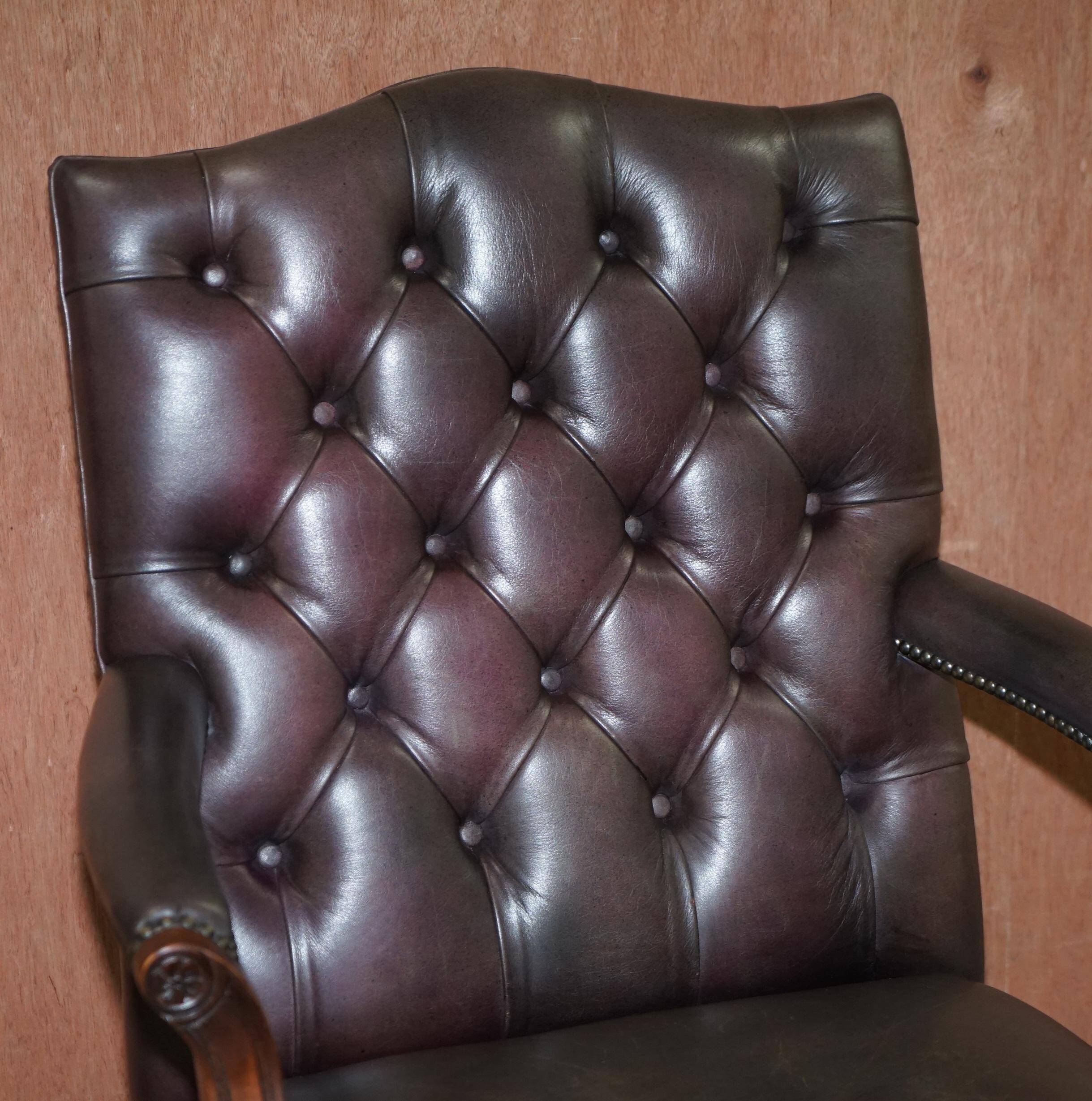 Gainsborough armchair George II leather Chesterfield hand-carved with claw and ball feet.