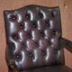 Gainsborough armchair George II leather Chesterfield hand-carved with claw and ball feet.