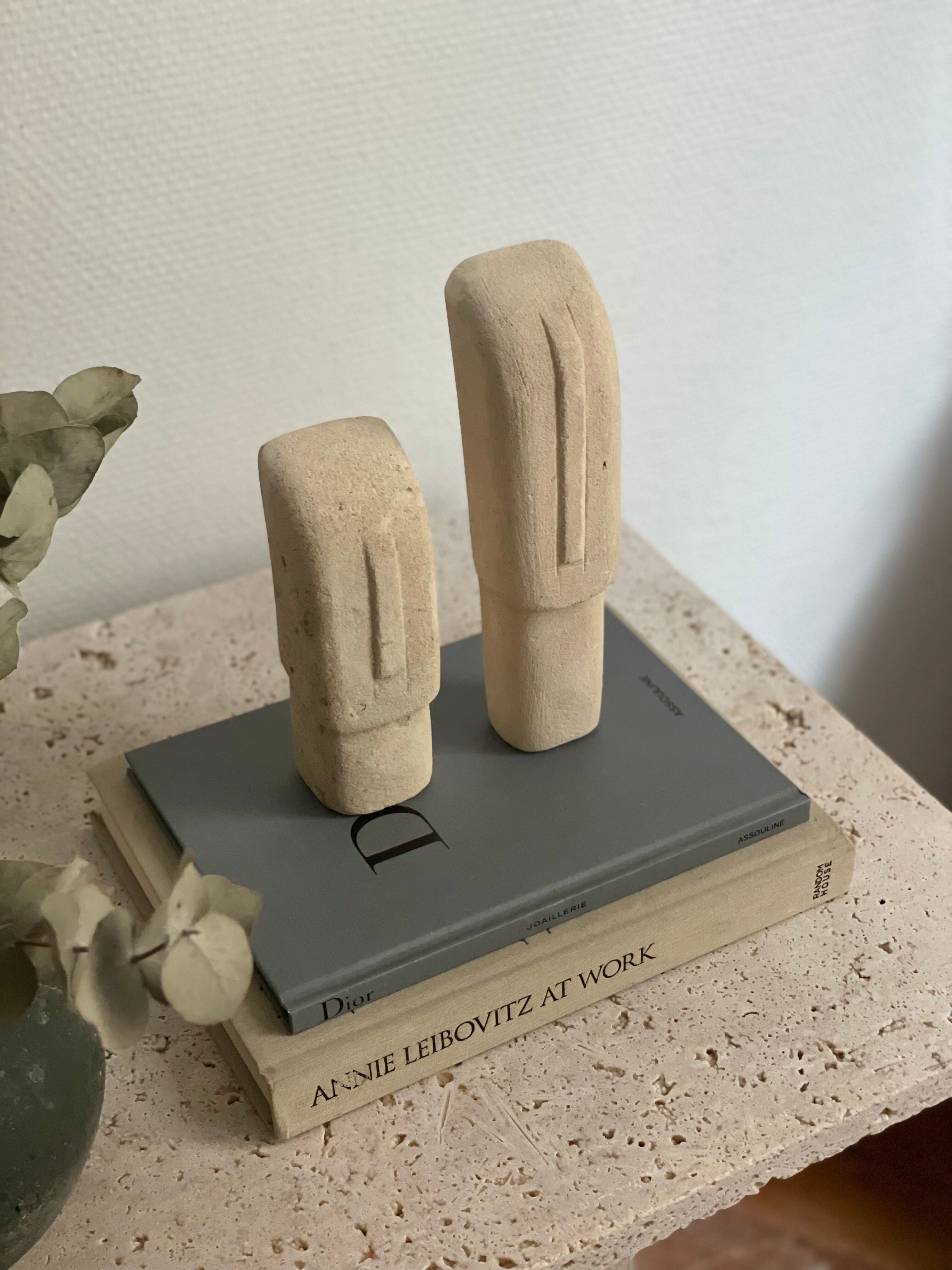 Set of two minimalist stone face statues