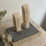 Set of two minimalist stone face statues