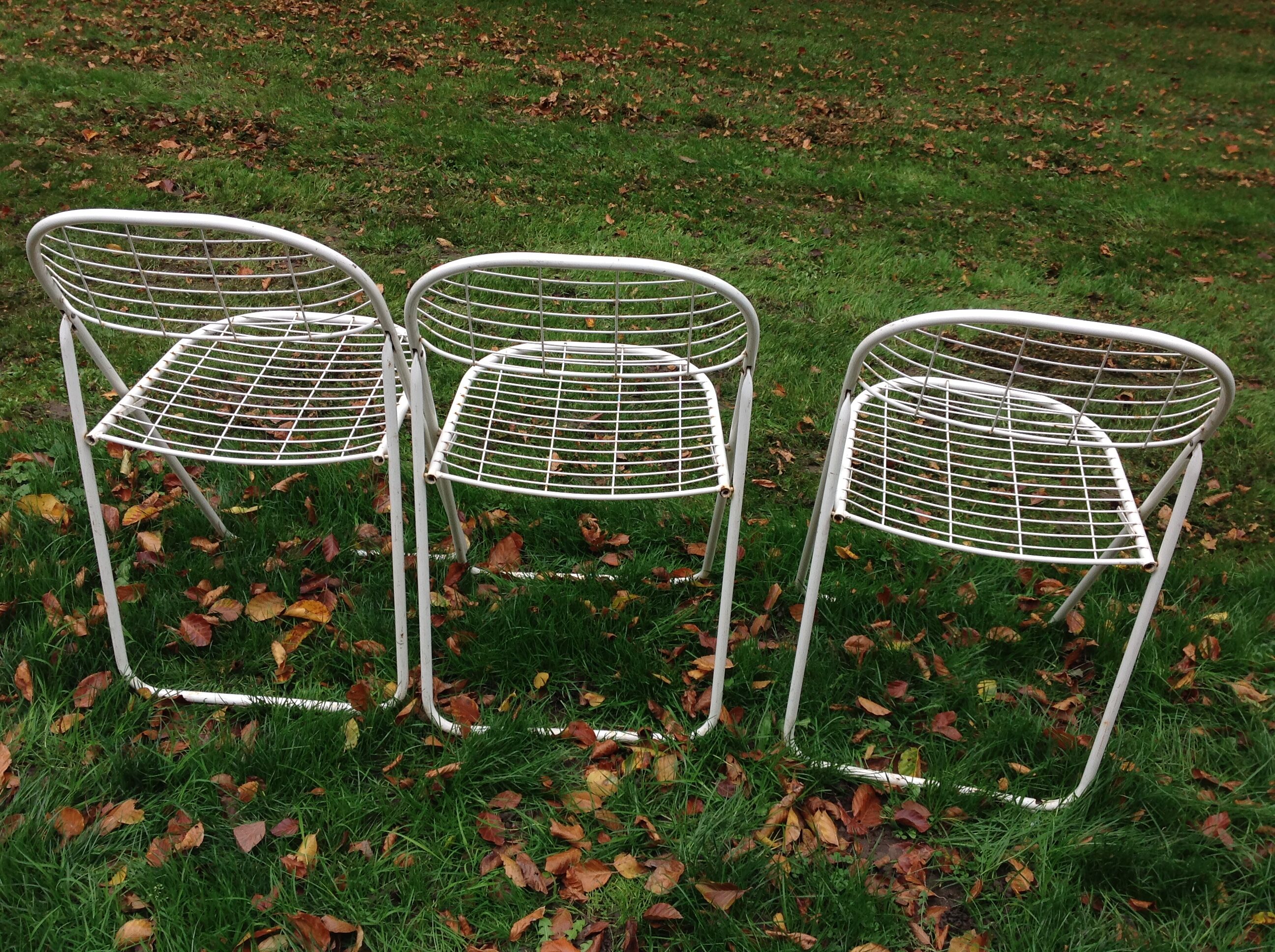 Trio of folding metal chairs
