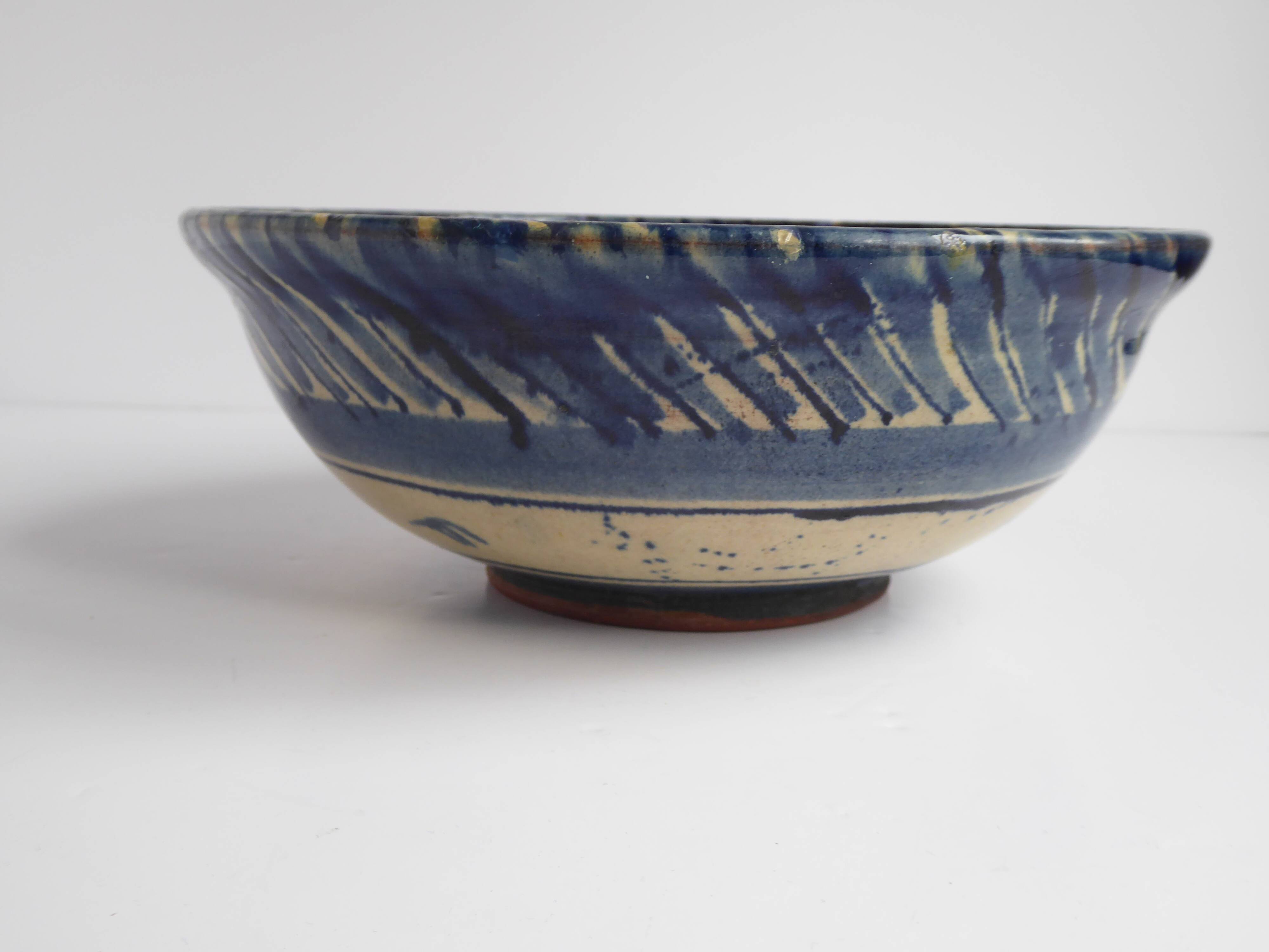 Blue enamelled terracotta cup