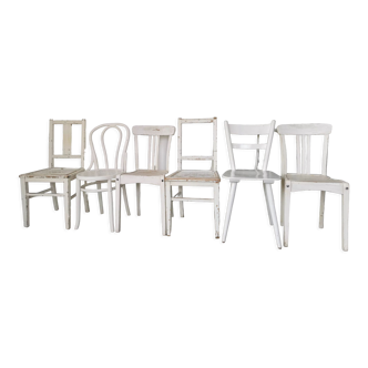 Set of 6 mismatched white chairs