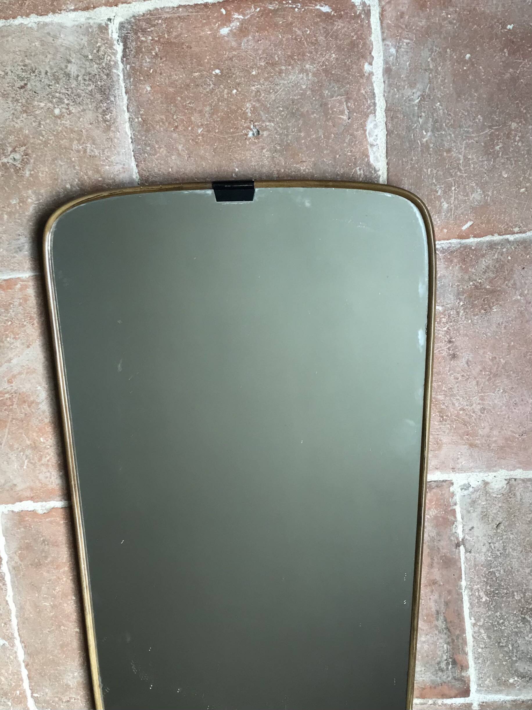 Vintage 1960 free-form mirror known as a rear-view mirror.