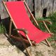 Former pliante long chair - wood foot rest - vintage red fabric