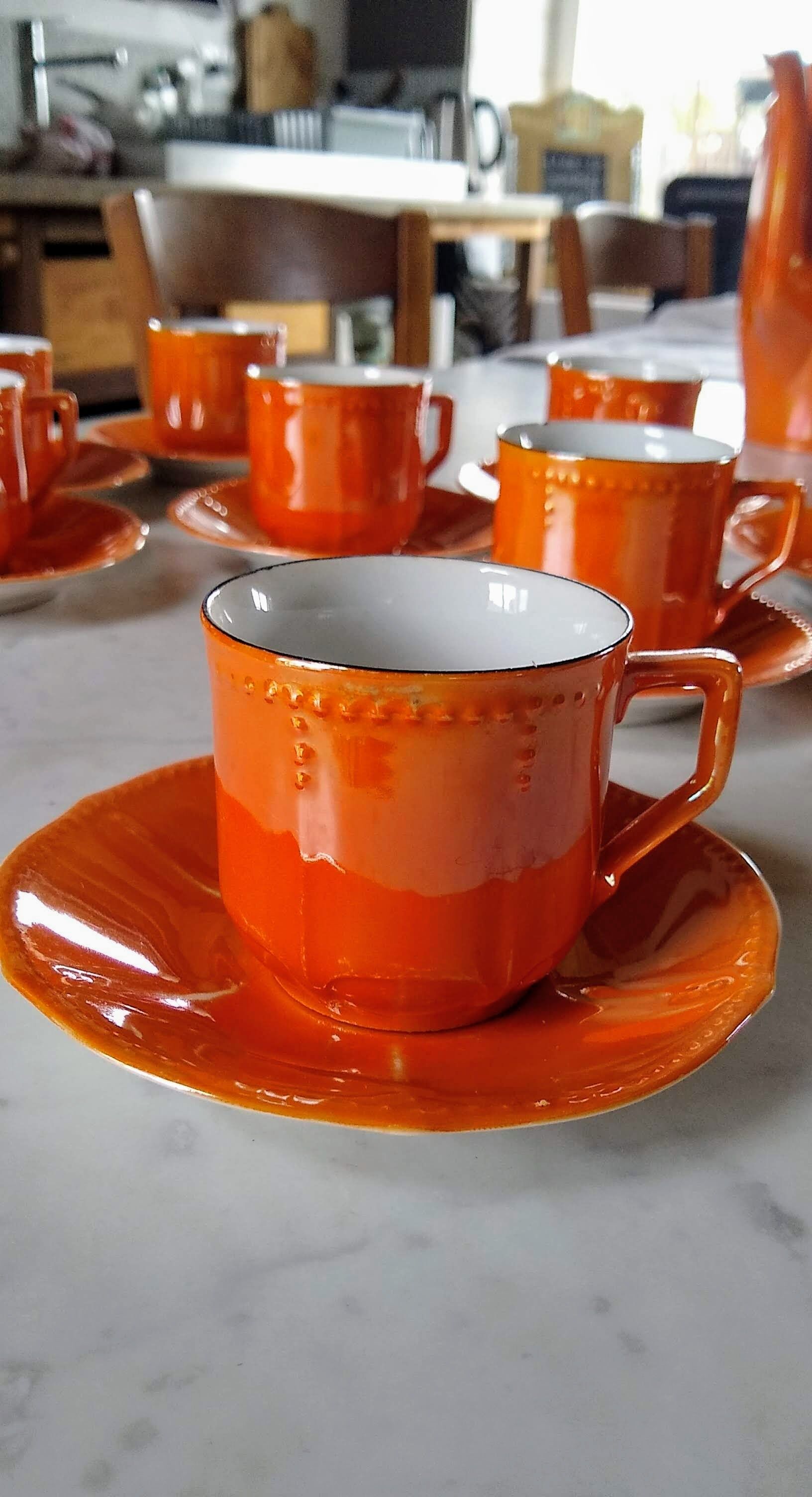 Iridescent orange porcelain coffee set from the 50s-60s with black edging