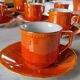 Iridescent orange porcelain coffee set from the 50s-60s with black edging