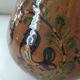 Glazed earthenware pitcher signed HR with a design of stylised birds.