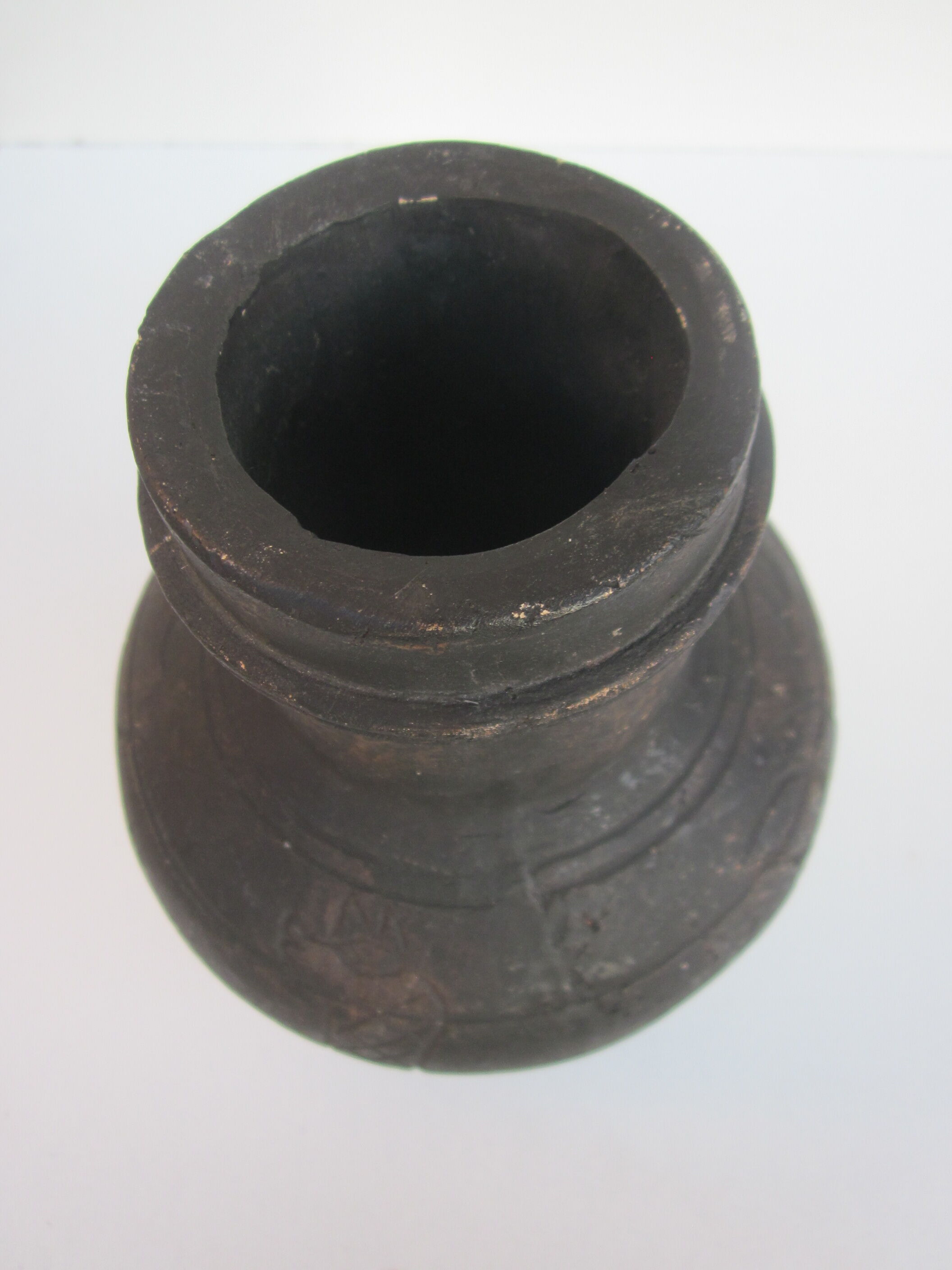Black African pottery with stylized giraffe pattern