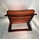 Duo of ochre leather and wood frame armchairs