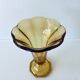Ancient tulip vase in amber glass