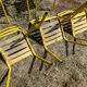 Lot of 11 yellow metallic bistro chairs from the 1950s