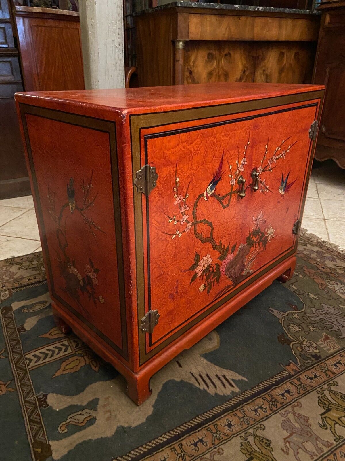 Low sideboard with lacquered decoration with birds on orange background Far East China Japan
