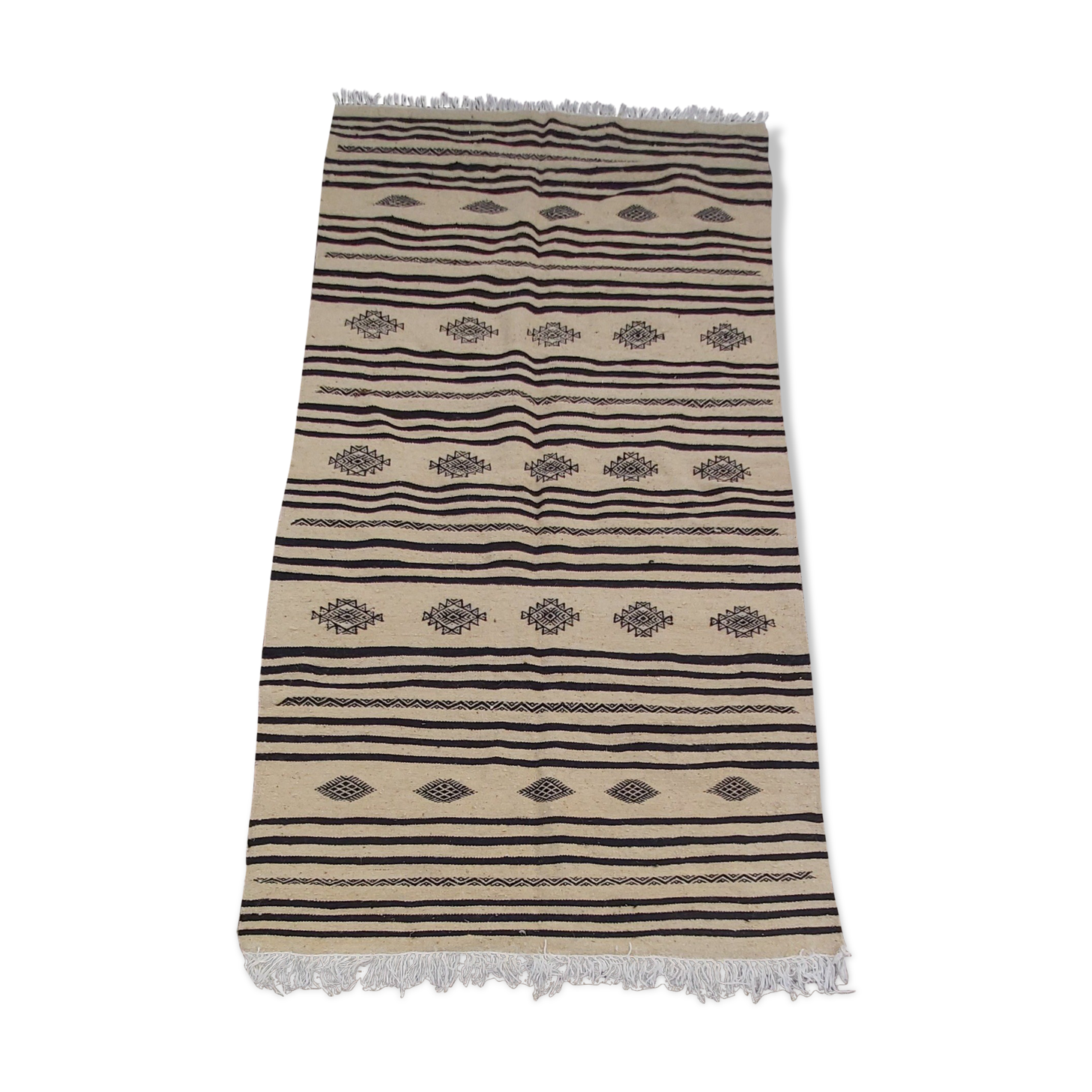 Traditional hand-woven beige and black carpet