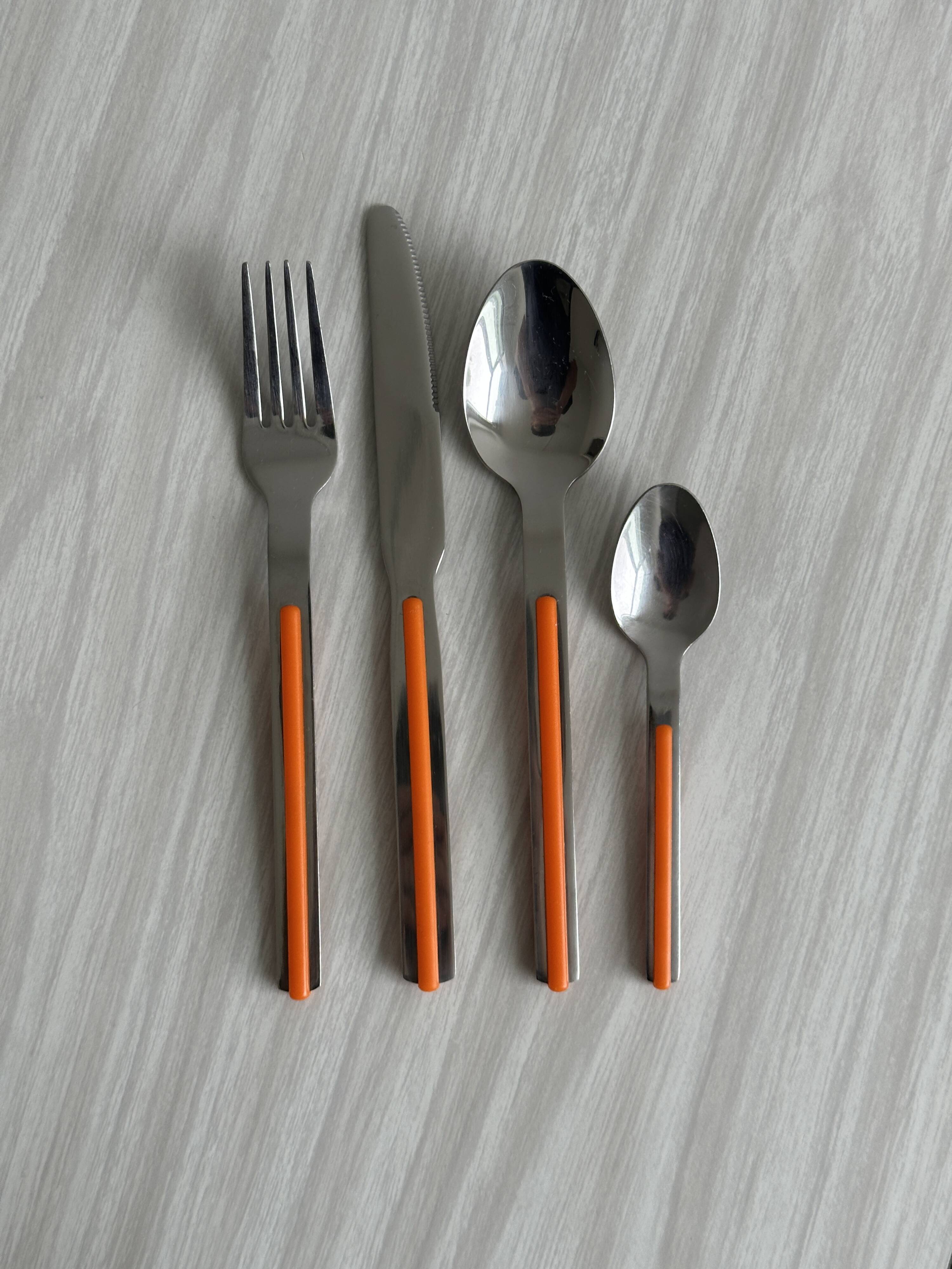 24 vintage stainless steel and orange plastic cutlery sets