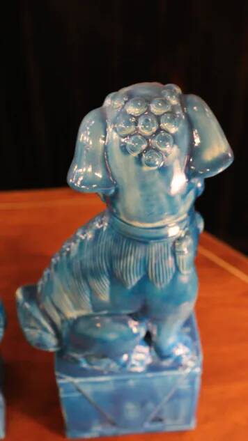Pair of Foo dog bookends in turquoise glazed ceramic, Manises