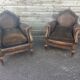 Pair of club armchairs in wood and leather, early 20th century.