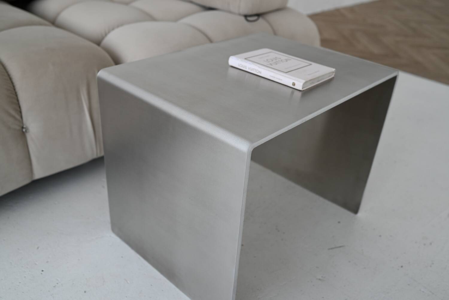 Minimalist brushed aluminum side table