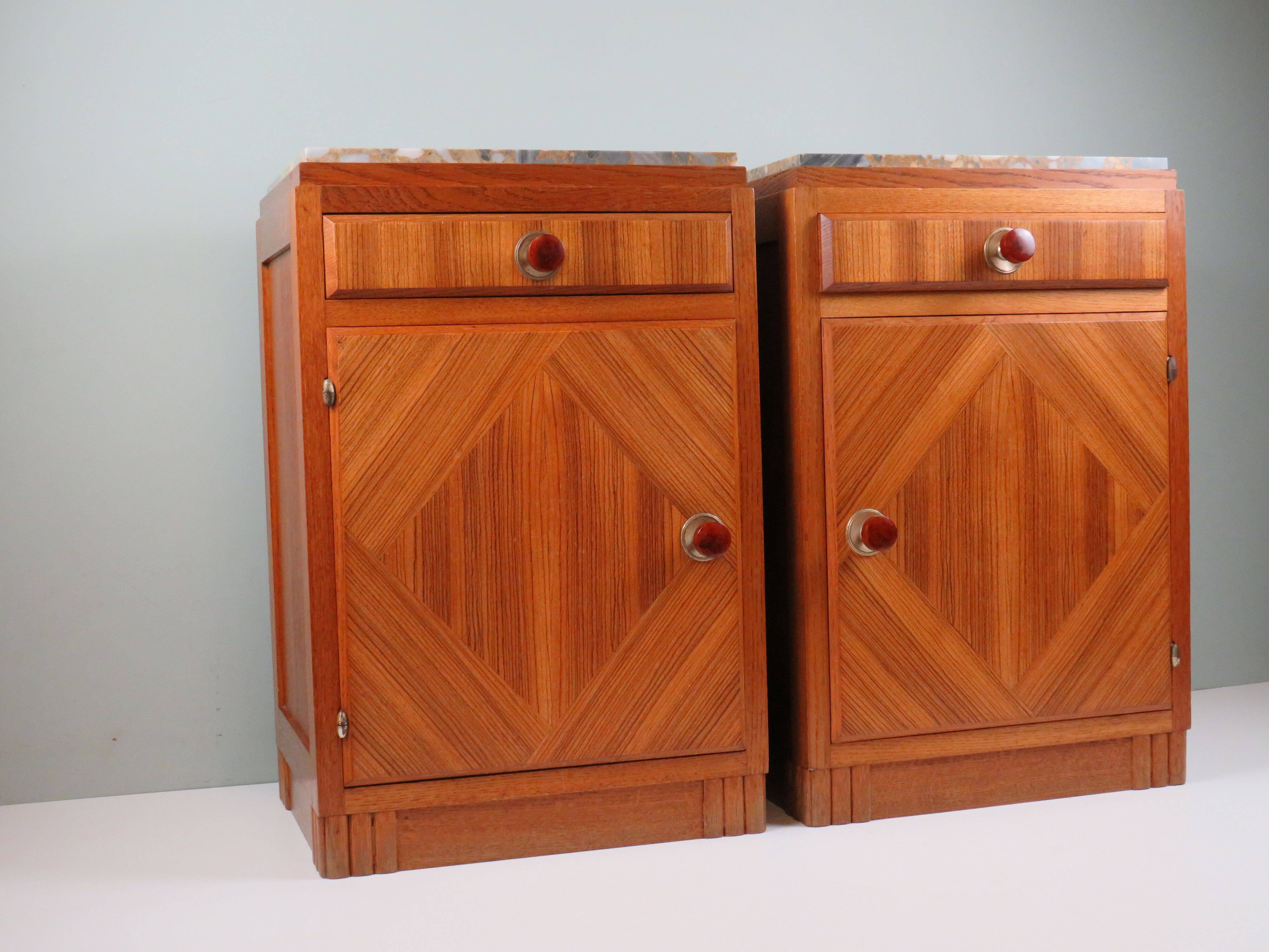 Art Deco bedside tables in oak with an inlaid marble top.